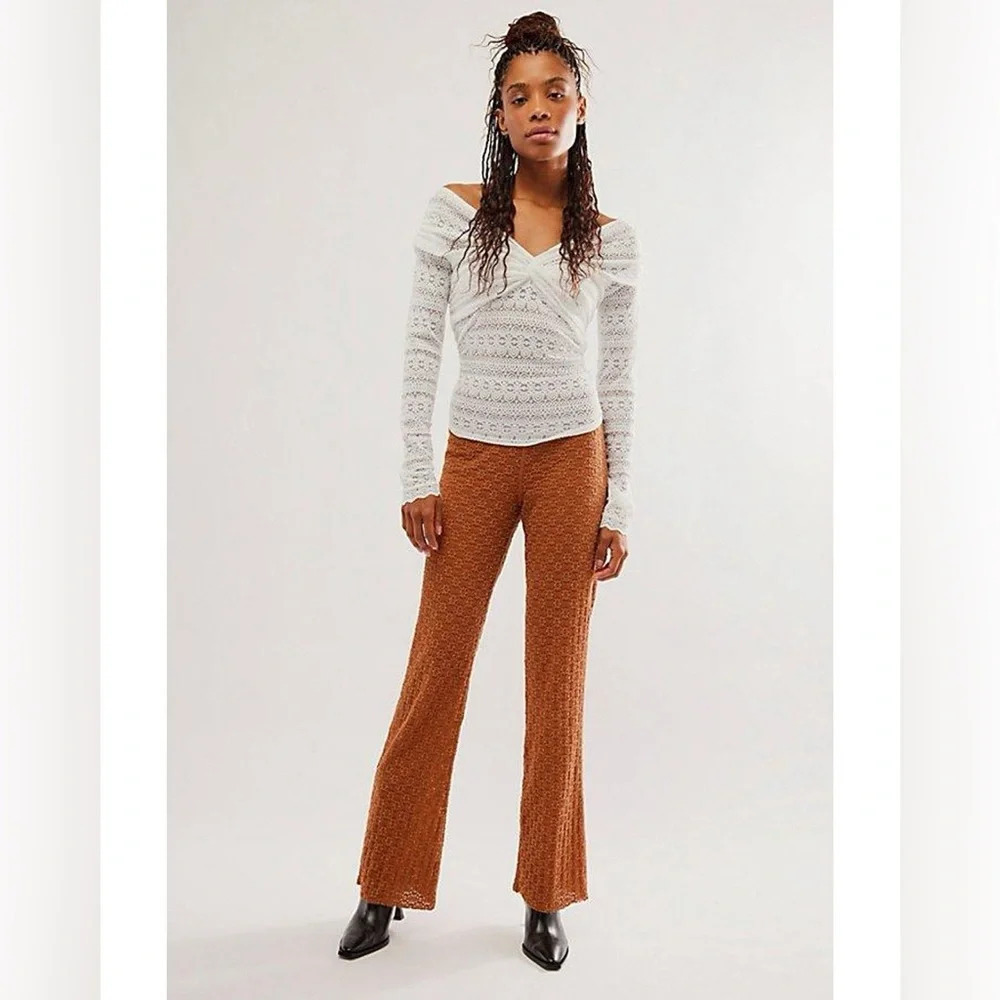 NWOT Free People
One Ona Lace orange - brown Flare pants in Size : M